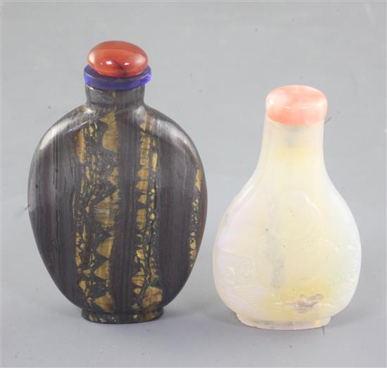 A Chinese carved opal snuff bottle and tigers eye mineral snuff bottle, early 20th century 6.5cm and 7.1cm